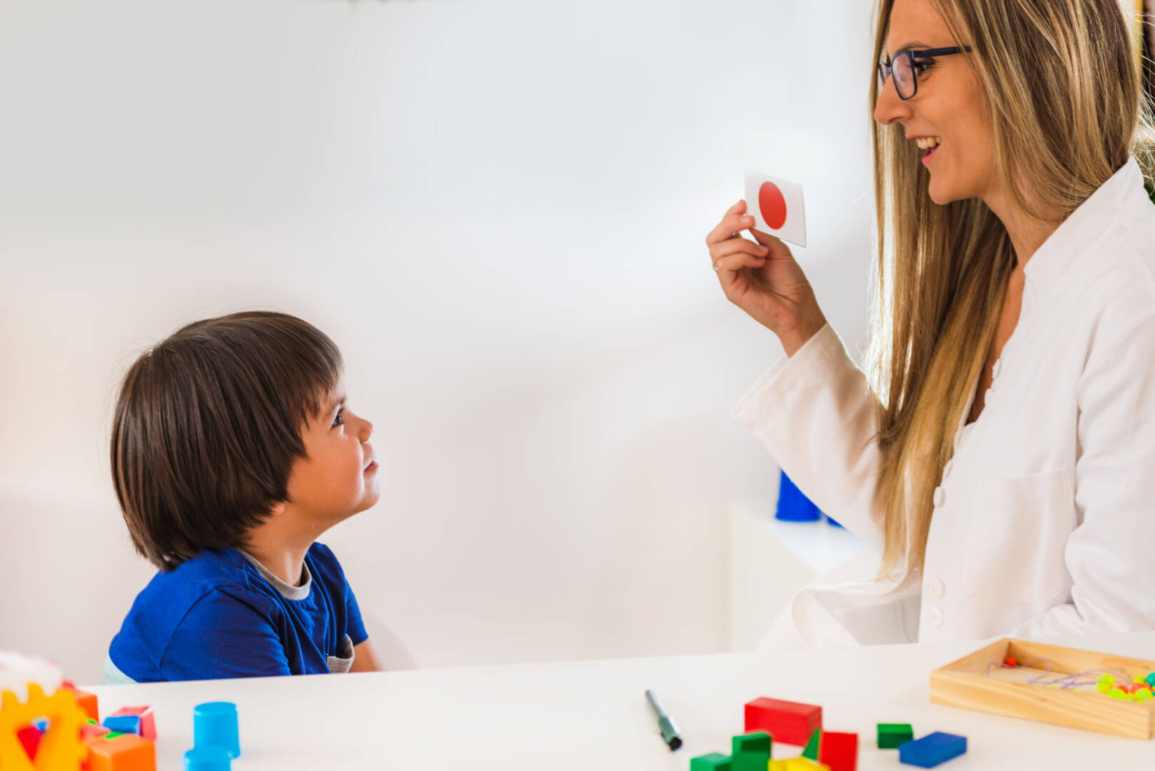 Child psychology, toddler doing logic tests with cards